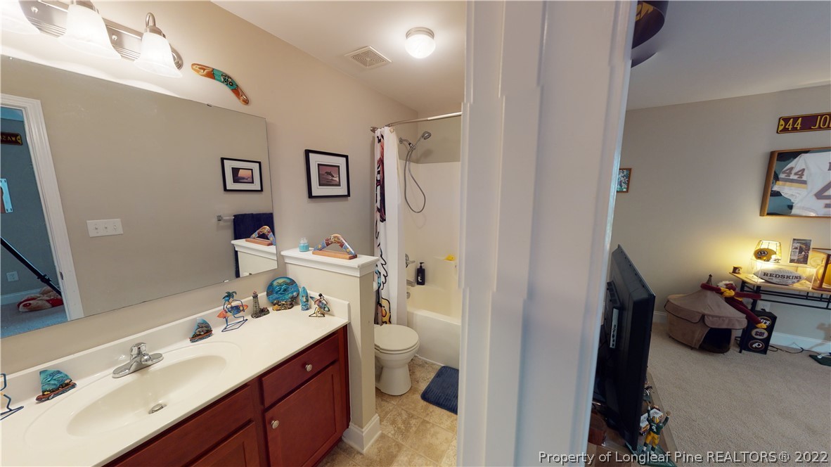 3428 Park Hill Road Fayetteville, NC 28311 - Photo 22 of 29 a spacious bathroom with a sink double vanity and a toilet