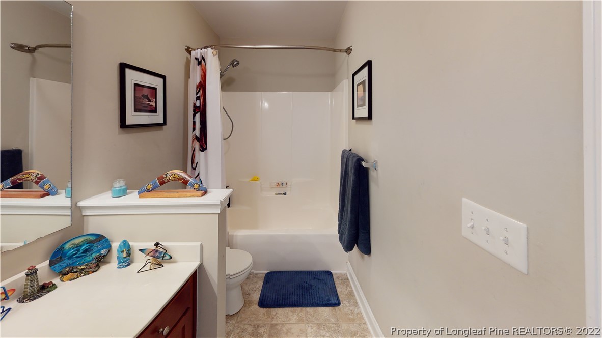 3428 Park Hill Road Fayetteville, NC 28311 - Photo 23 of 29 a bathroom with a tub sink and vanity