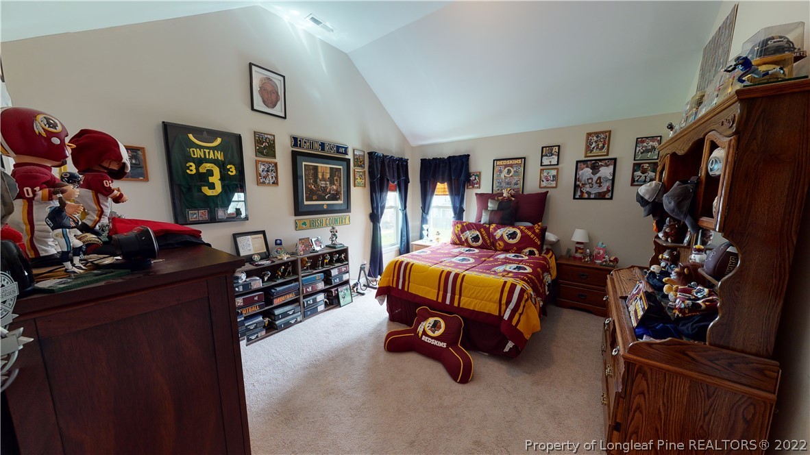 3428 Park Hill Road Fayetteville, NC 28311 - Photo 24 of 29 a bedroom with furniture and a flat screen tv
