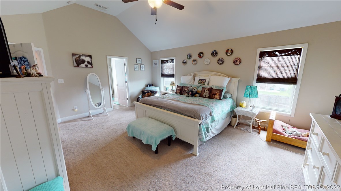 3428 Park Hill Road Fayetteville, NC 28311 - Photo 10 of 29 a spacious bedroom with a bed couch and a window
