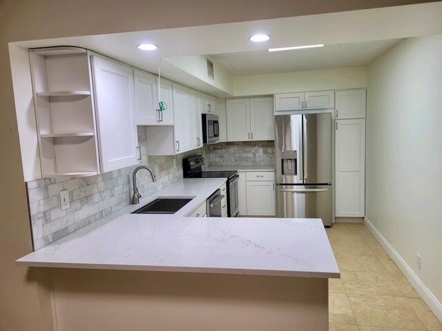 3150 Leewood Terrace, Unit L125 Boca Raton, FL 33431 - Photo 6 of 18 KITCHEN1
