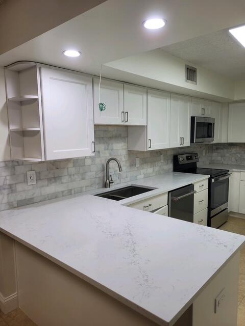 3150 Leewood Terrace, Unit L125 Boca Raton, FL 33431 - Photo 7 of 18 KITCHEN2