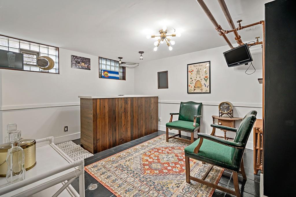 200 Richbarn Road Pittsburgh, PA 15212 - Photo 11 of 14 a living room with furniture and a chandelier