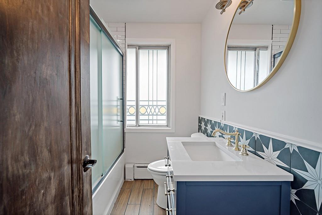 200 Richbarn Road Pittsburgh, PA 15212 - Photo 6 of 14 a bathroom with a sink a mirror and a window