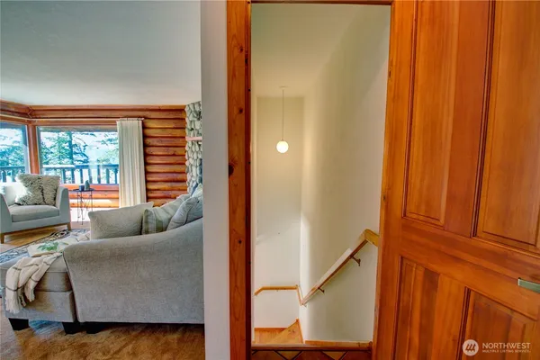 a bedroom with furniture and large window