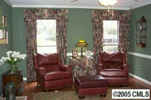 6639 Sharon Road Charlotte, NC 28210 - Photo 3 of 8 a living room with furniture and a potted plant