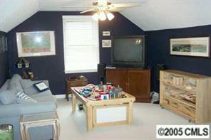 6639 Sharon Road Charlotte, NC 28210 - Photo 7 of 8 a living room with furniture and a flat screen tv