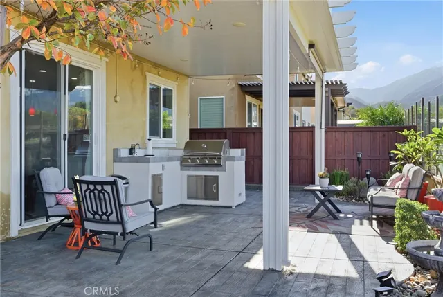 a view of a swimming pool with a table and chairs