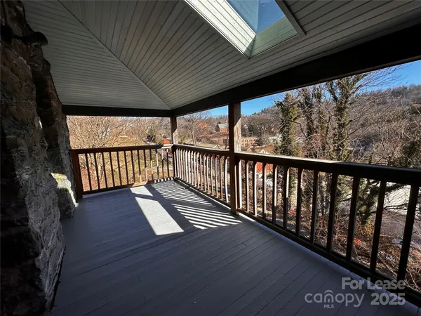 a view of porch with wooden floor