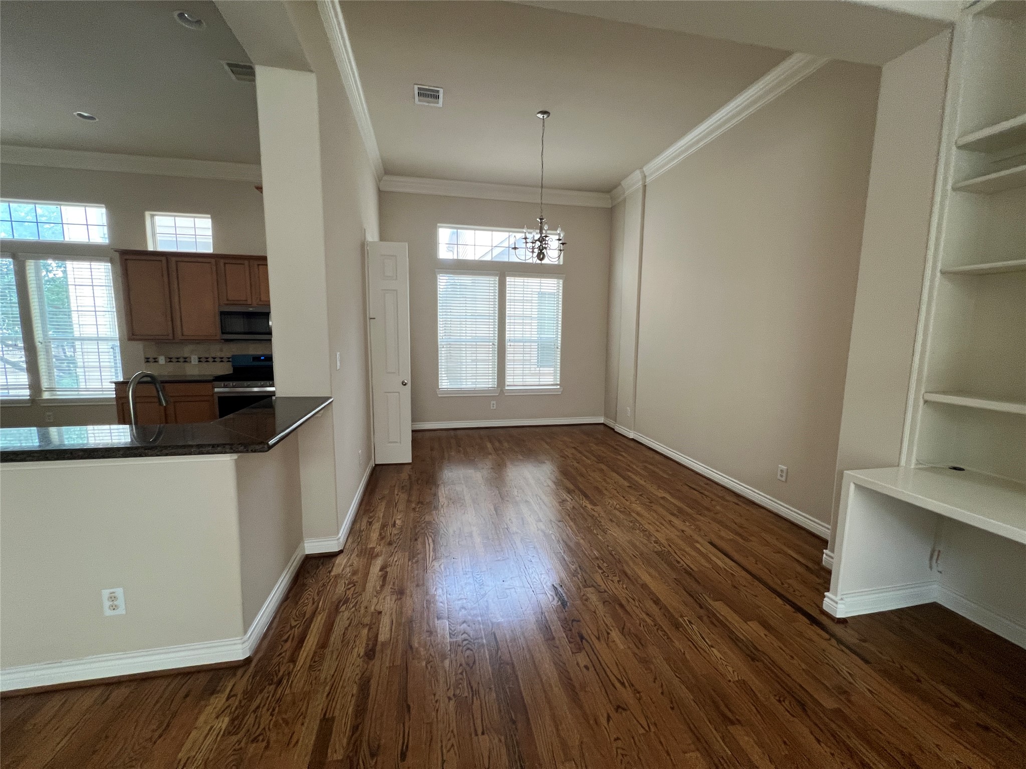 5940 Kansas Street Houston, TX 77007 - Photo 12 of 29 wooden floor in an empty room with a window
