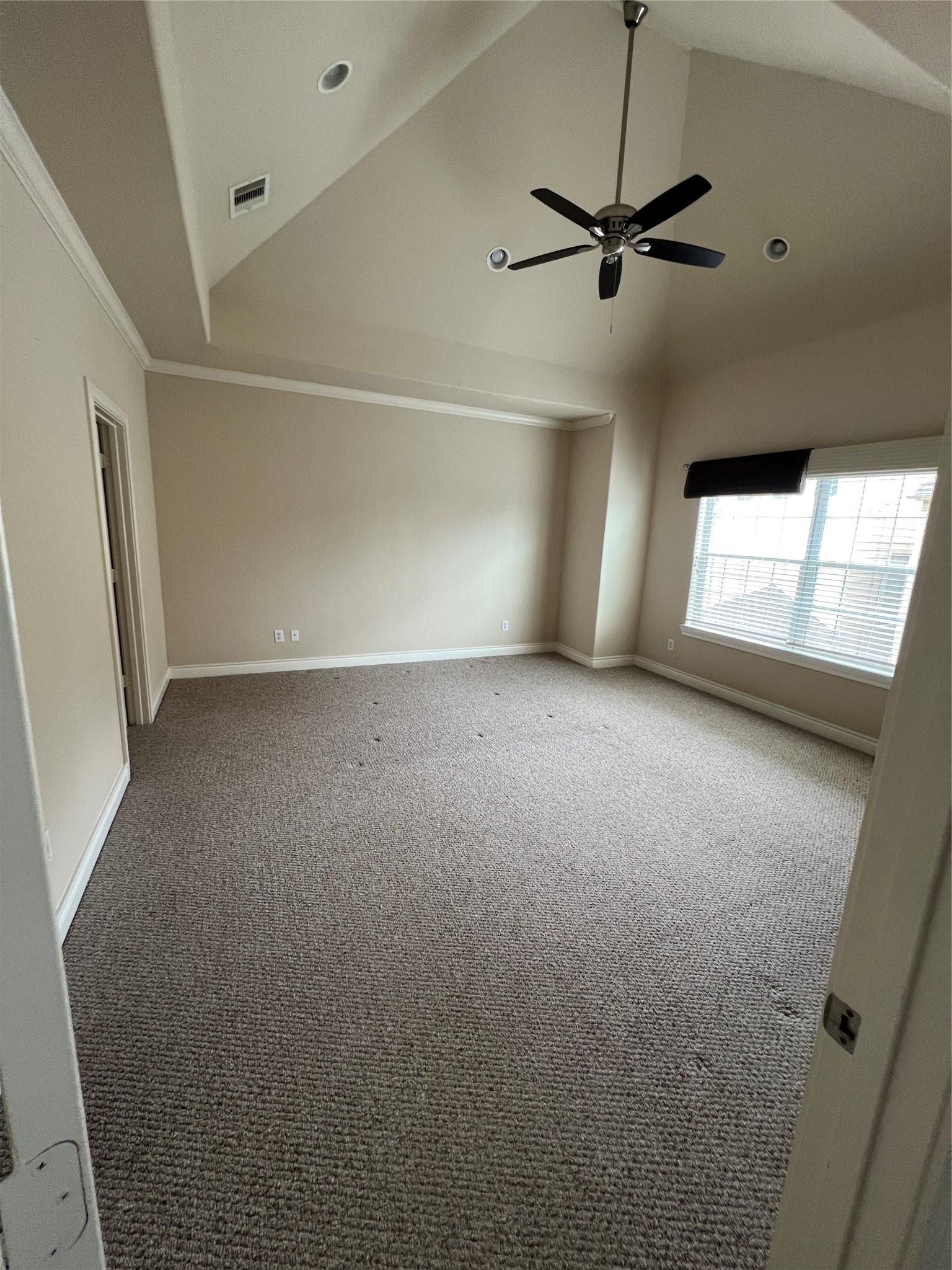 5940 Kansas Street Houston, TX 77007 - Photo 18 of 29 a view of a livingroom with a ceiling fan and window