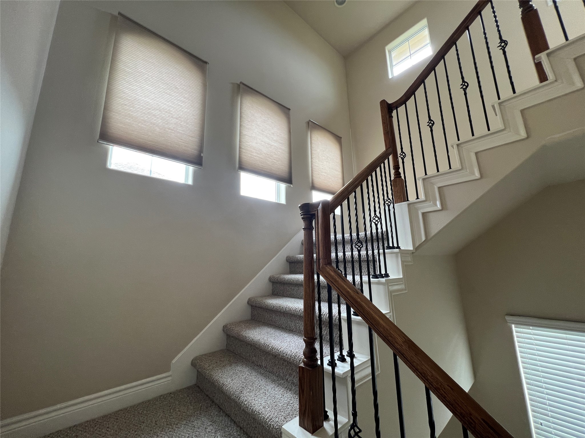 5940 Kansas Street Houston, TX 77007 - Photo 29 of 29 a view of staircase with wooden floor and white walls