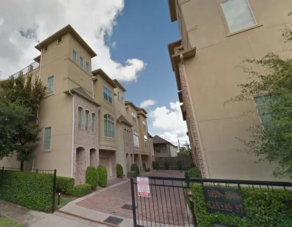 front view of a house with a small yard