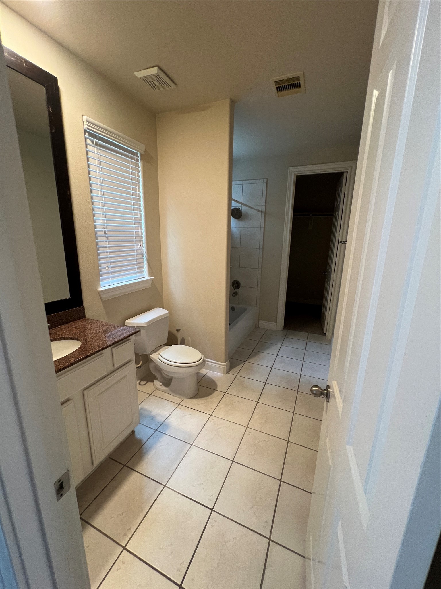 5940 Kansas Street Houston, TX 77007 - Photo 7 of 29 a bathroom with a sink a toilet and a mirror