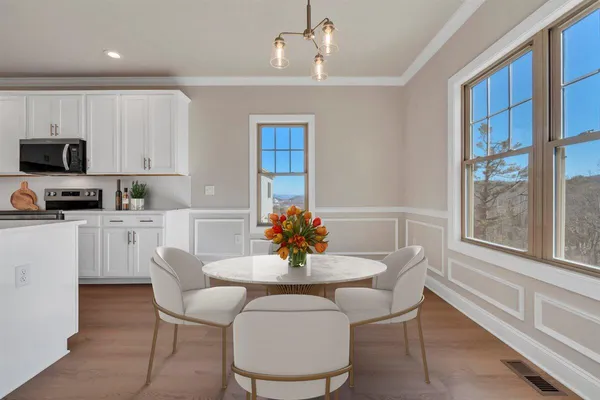 a dining room with furniture and window