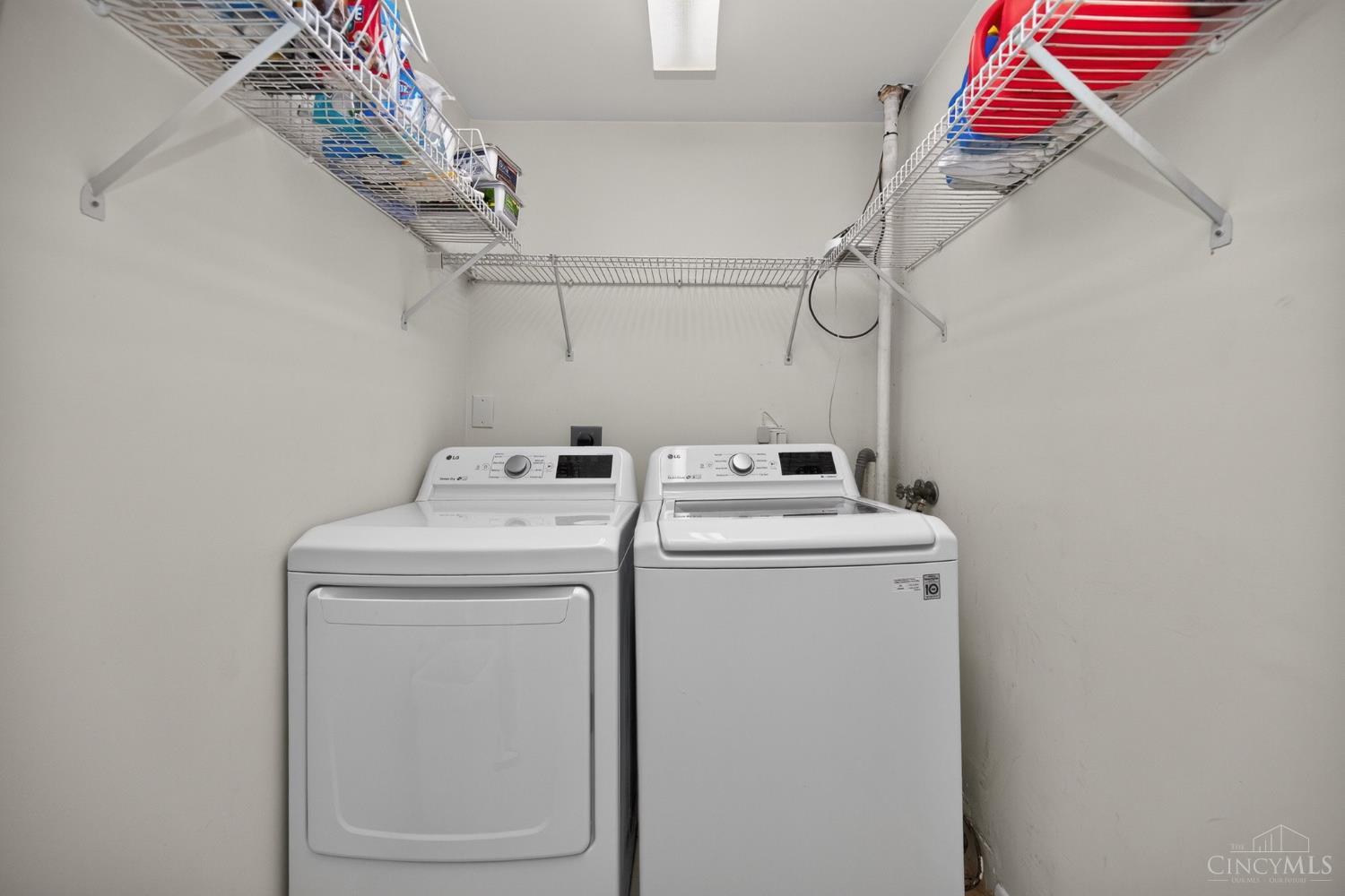 3078 Ebenezer Road Cincinnati, OH 45233 - Photo 36 of 51 Adjacent to the family room, this laundry is compact, yet convenient, with overhead shelving.
