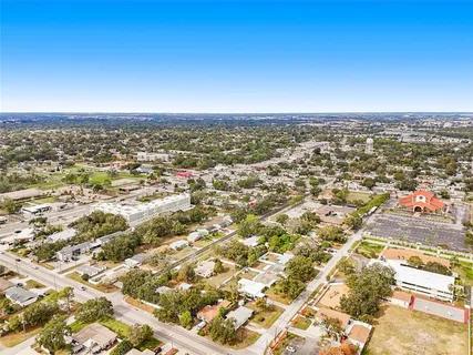 an aerial view of residential building and car parked