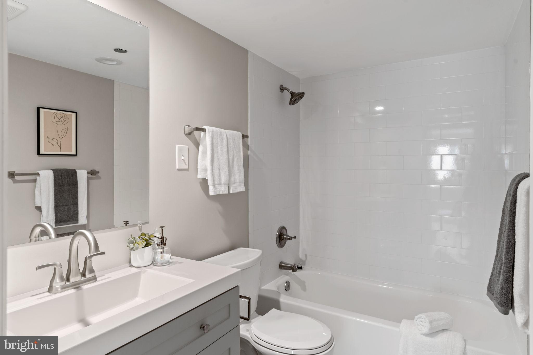 1301 North Courthouse Road, Unit 914 Arlington, VA 22201 - Photo 20 of 50 a bathroom with a sink toilet tub and shower