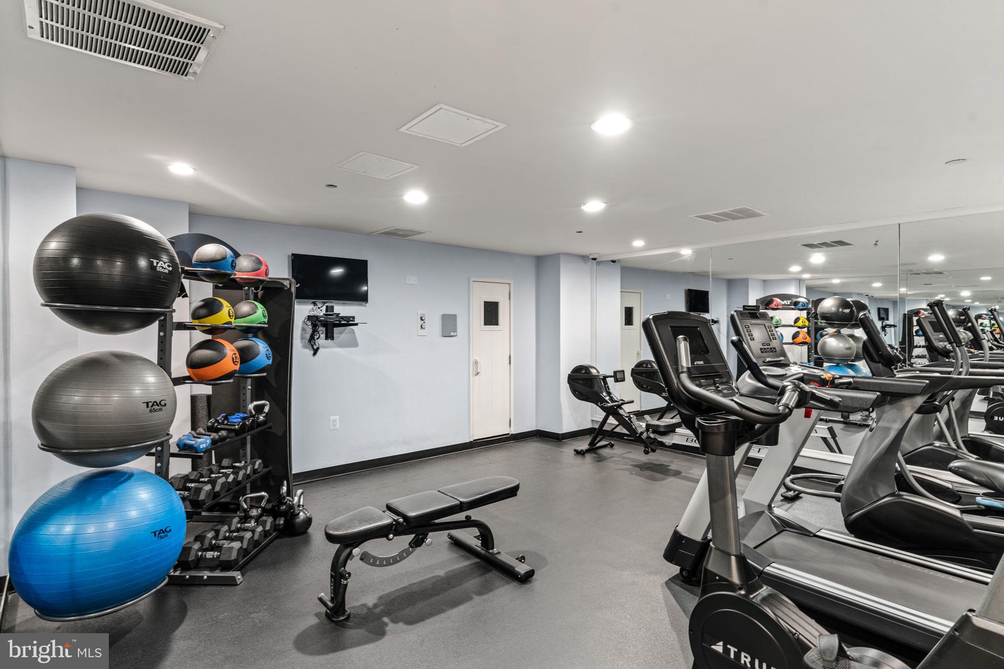 1301 North Courthouse Road, Unit 914 Arlington, VA 22201 - Photo 31 of 50 a view of a room with gym equipment