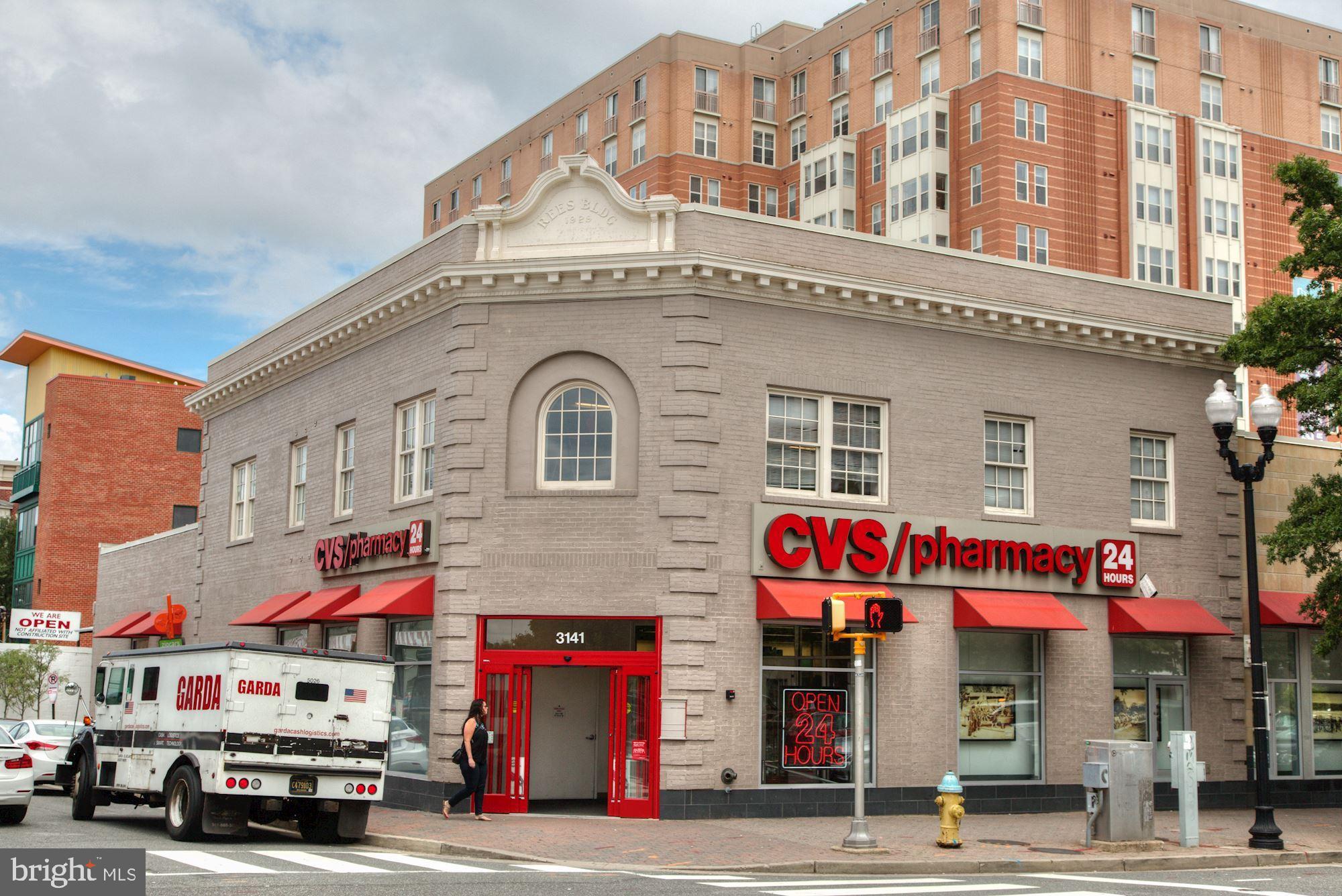 1301 North Courthouse Road, Unit 914 Arlington, VA 22201 - Photo 39 of 50 a front view of multi story building with retail shops