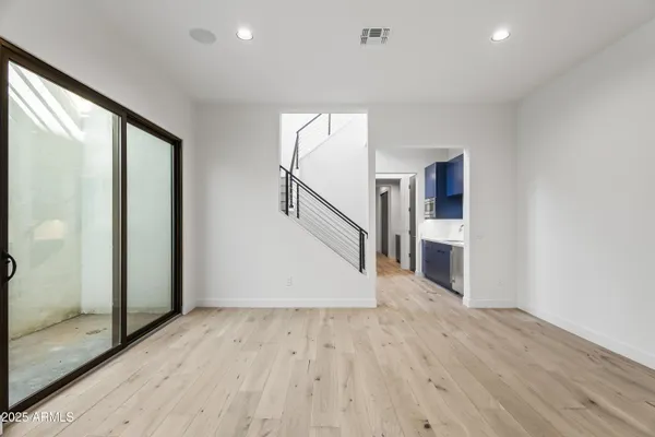 a view of entryway with wooden floor