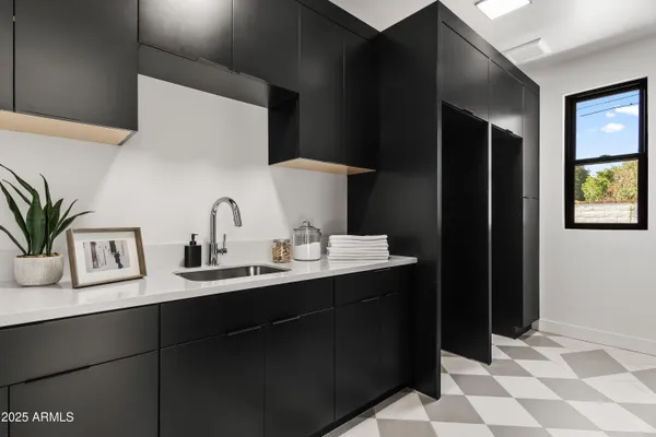 a bathroom with a sink a toilet and mirror