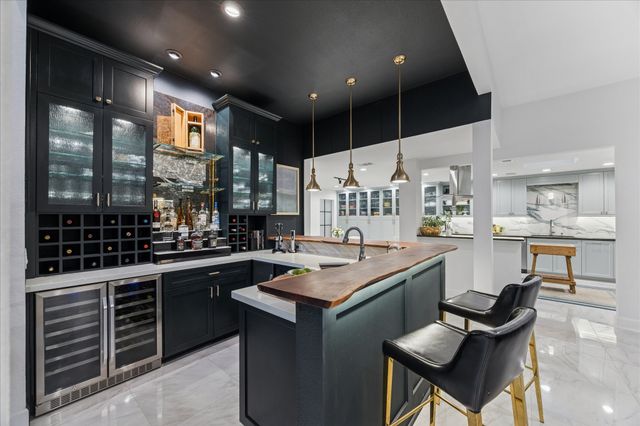 a living room with furniture a ceiling fan and a flat screen tv