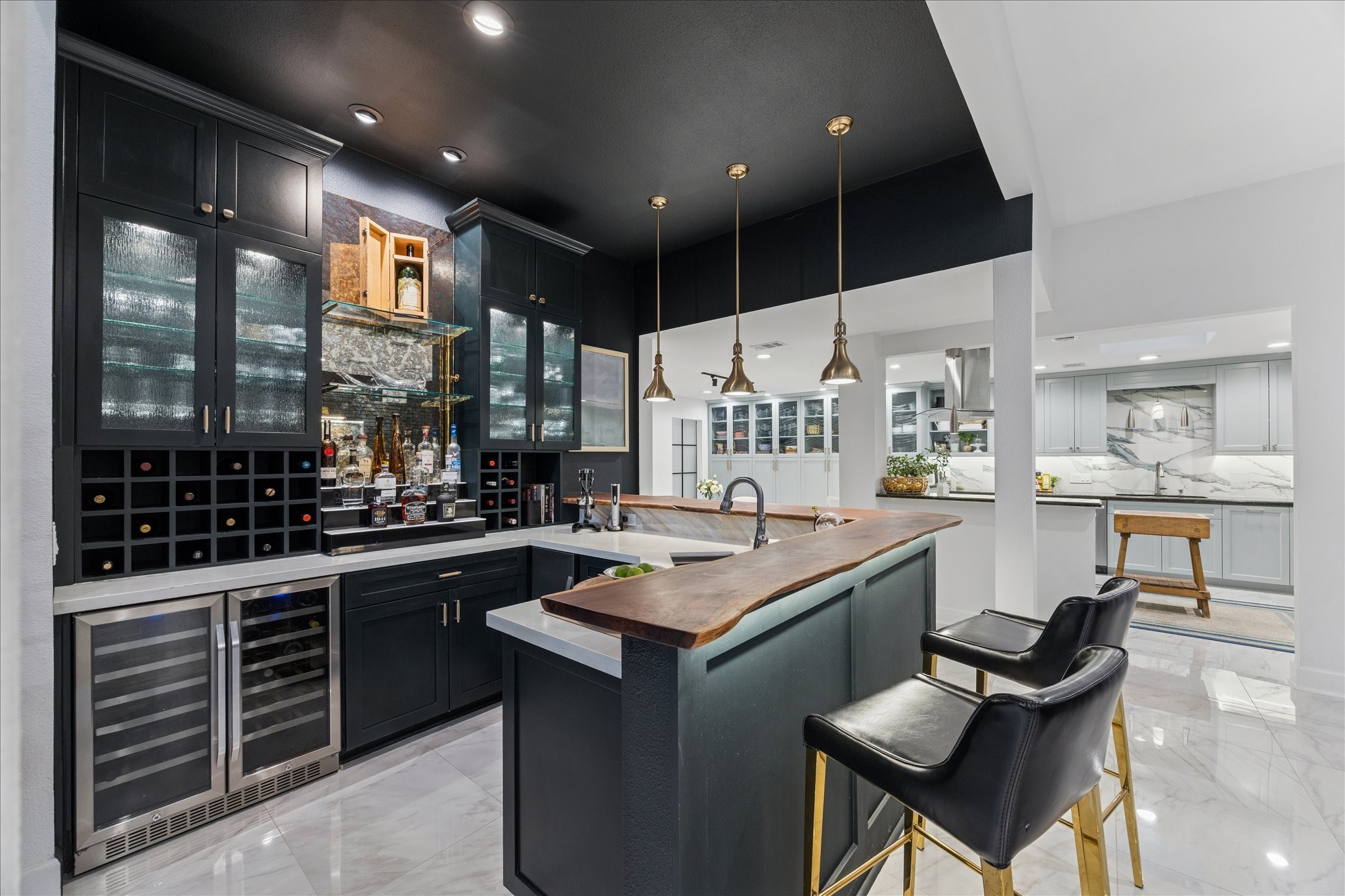 45 Patti Lynn Lane Houston, TX 77024 - Photo 11 of 49 a kitchen with kitchen island granite countertop lots of counter top space and stainless steel appliances