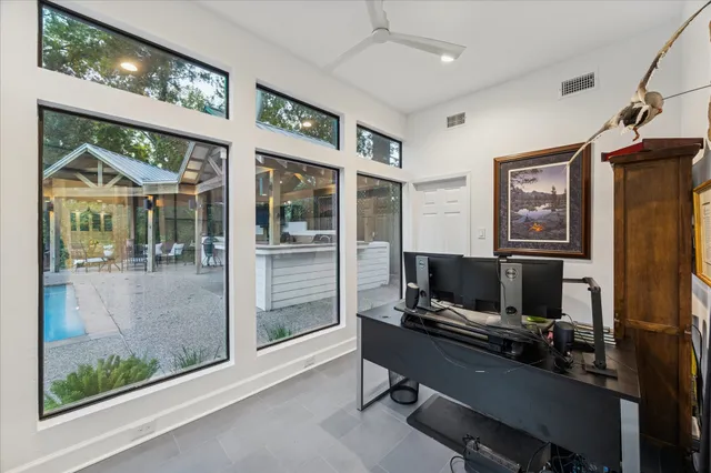 a kitchen with stainless steel appliances kitchen island granite countertop a sink and cabinets