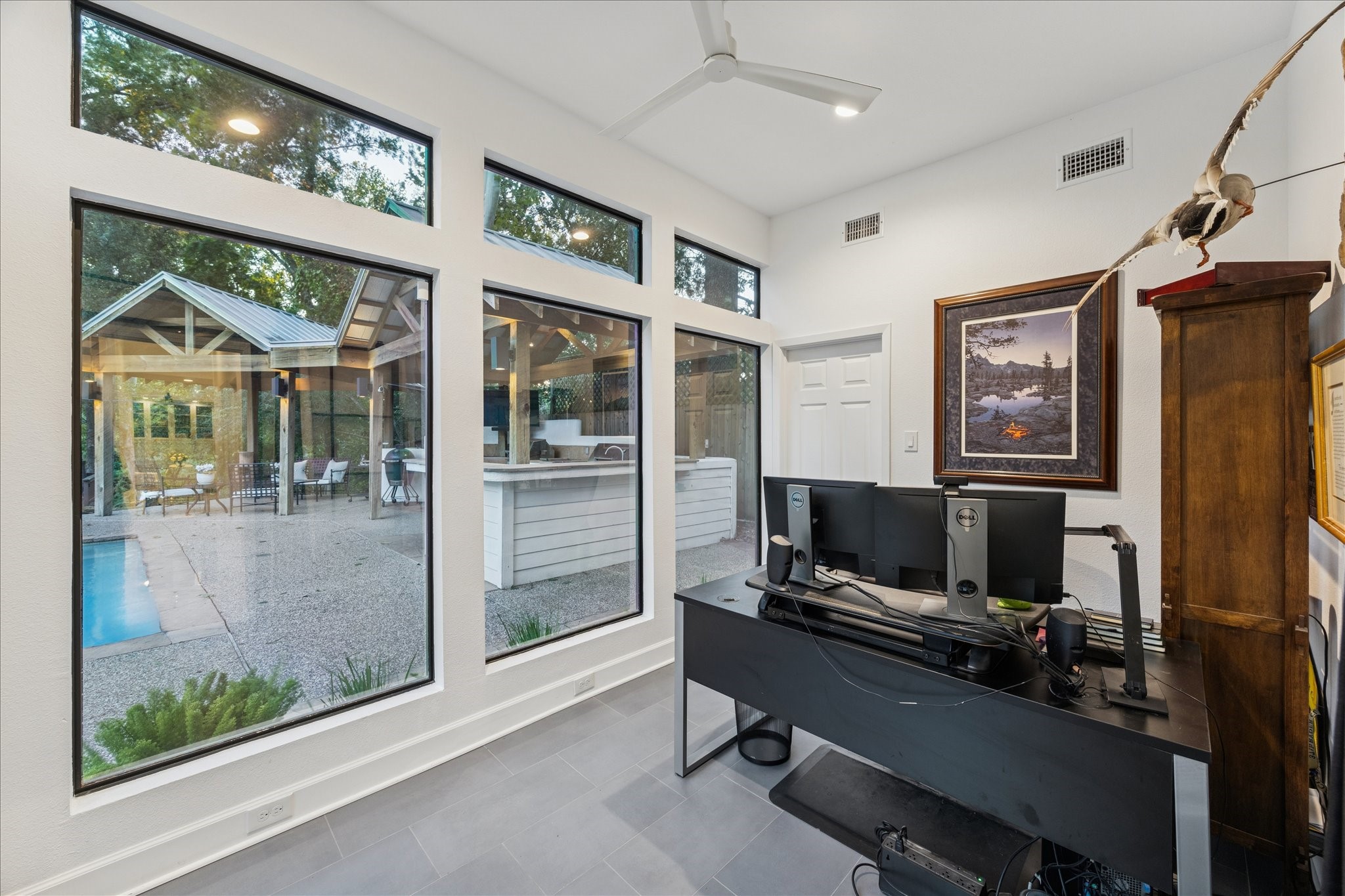 45 Patti Lynn Lane Houston, TX 77024 - Photo 13 of 49 a living room with furniture a ceiling fan and a flat screen tv