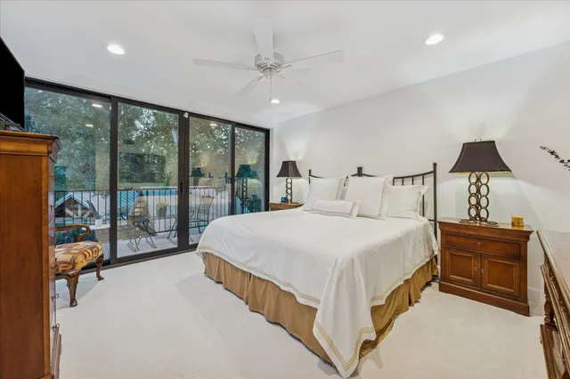 a bathroom with a sink a toilet a mirror and shower