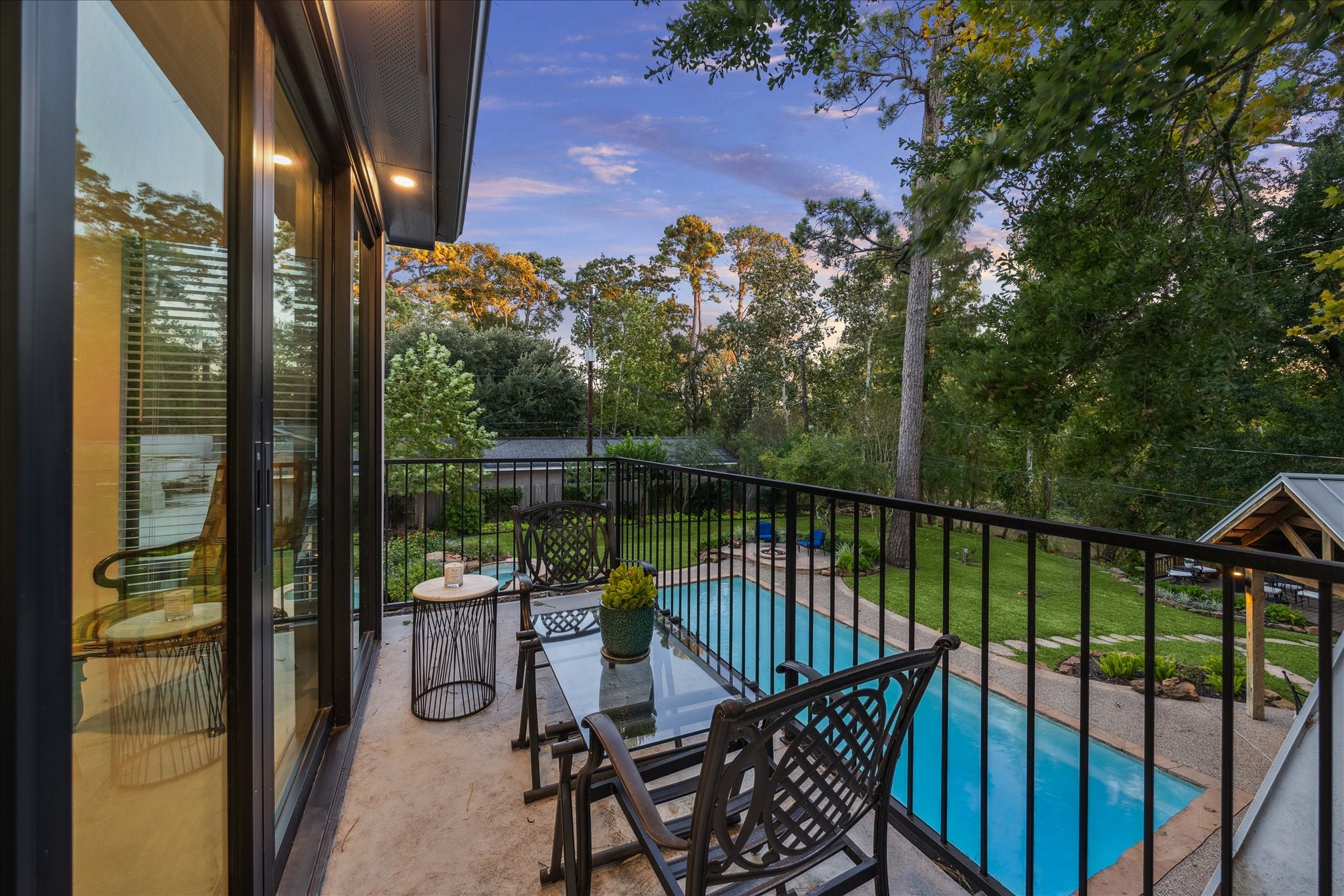 45 Patti Lynn Lane Houston, TX 77024 - Photo 22 of 49 a view of a balcony with wooden floor and outdoor seating