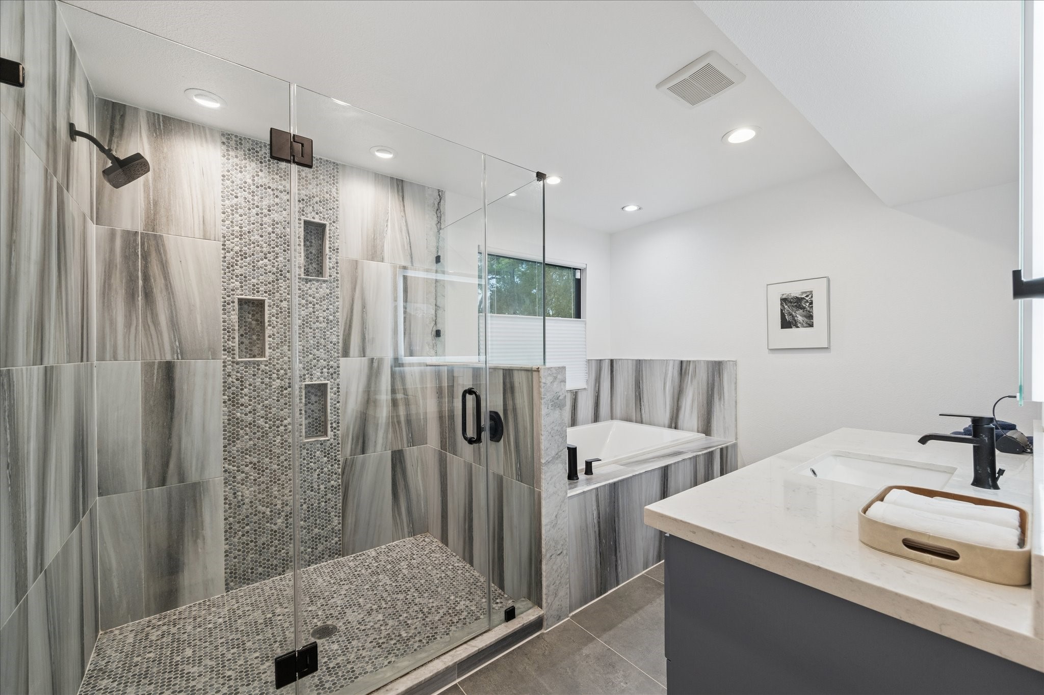 45 Patti Lynn Lane Houston, TX 77024 - Photo 23 of 49 a bathroom with a granite countertop sink a shower and a mirror