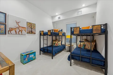 an empty room with closet and mirror