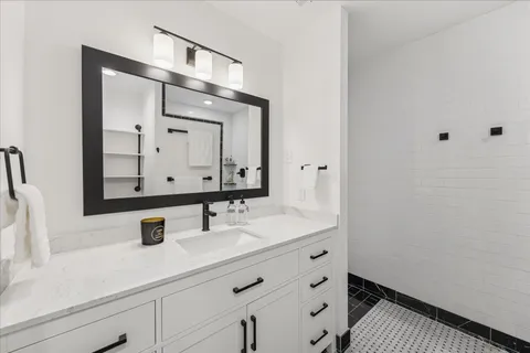 a kitchen with a sink and refrigerator