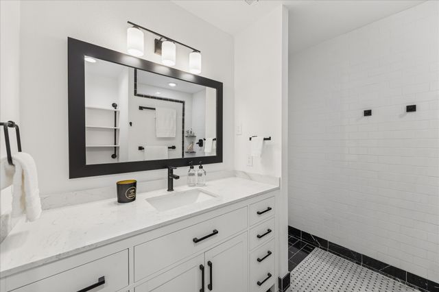 a kitchen with a sink and refrigerator