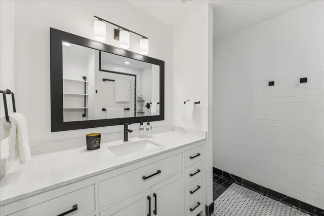 a kitchen with a sink and refrigerator