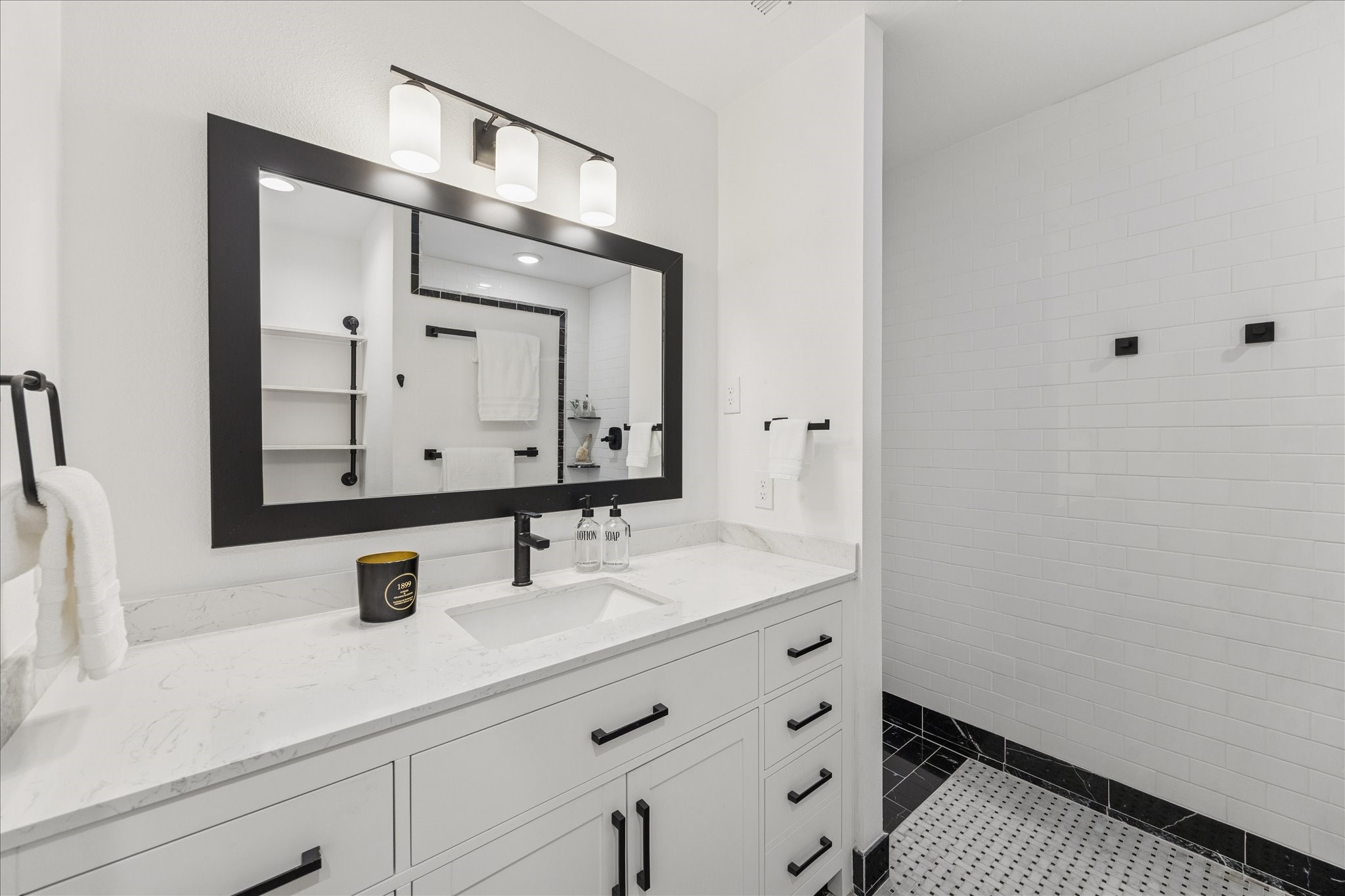 45 Patti Lynn Lane Houston, TX 77024 - Photo 30 of 49 a bathroom with a sink vanity and mirror