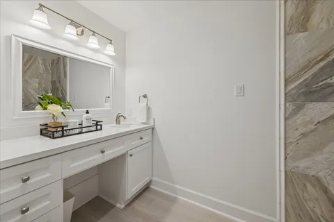 a kitchen with white cabinets and appliances