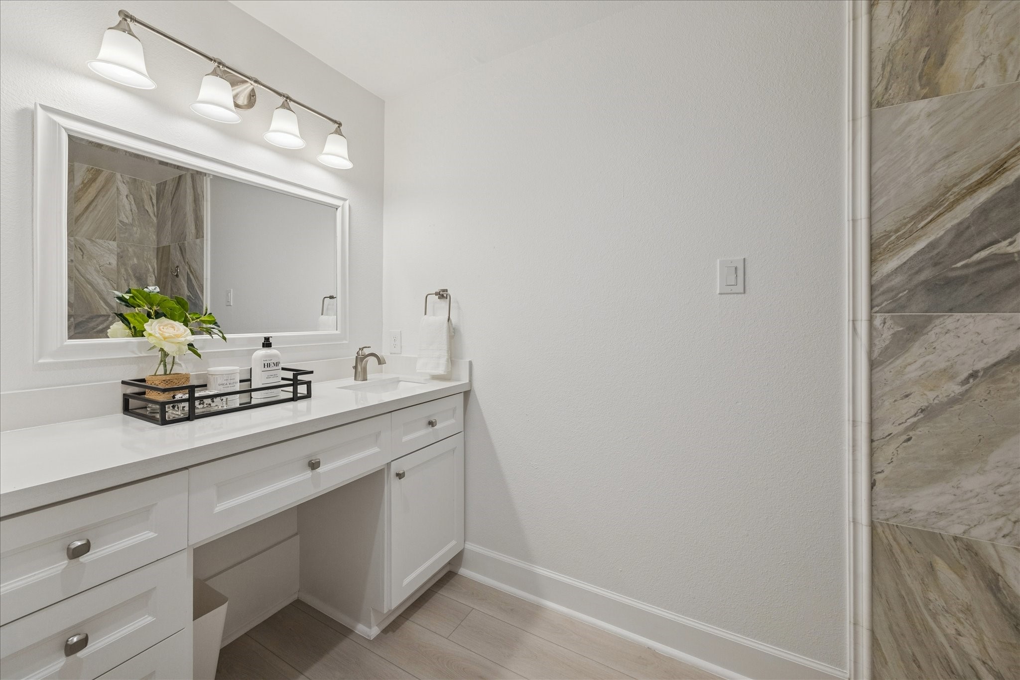 45 Patti Lynn Lane Houston, TX 77024 - Photo 31 of 49 a bathroom with a sink and a mirror