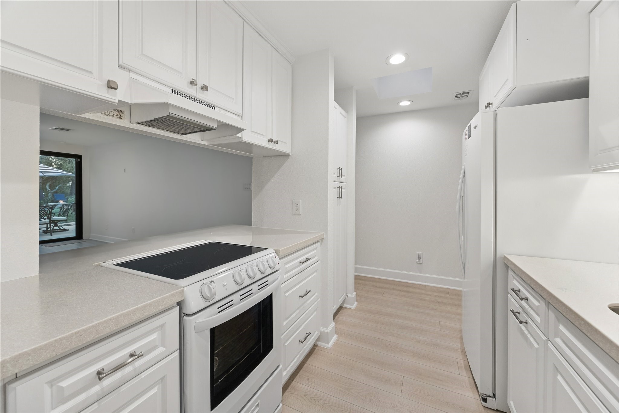 45 Patti Lynn Lane Houston, TX 77024 - Photo 34 of 49 a kitchen with white cabinets and appliances