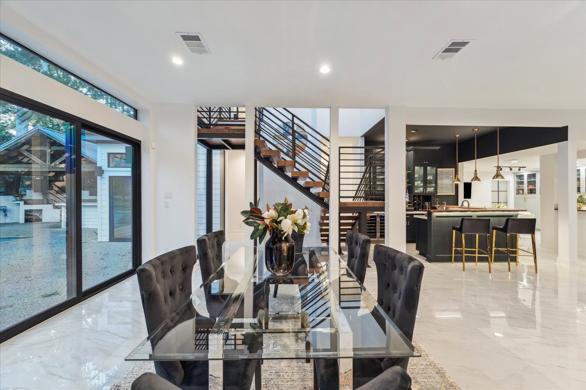 45 Patti Lynn Lane Houston, TX 77024 - Photo 4 of 49 a dining room with furniture floor to ceiling windows and view