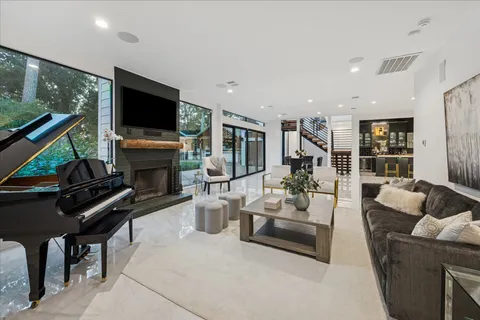 a kitchen with stainless steel appliances kitchen island granite countertop a refrigerator and cabinets