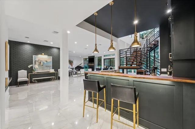 a utility room with multiple dryer and washer