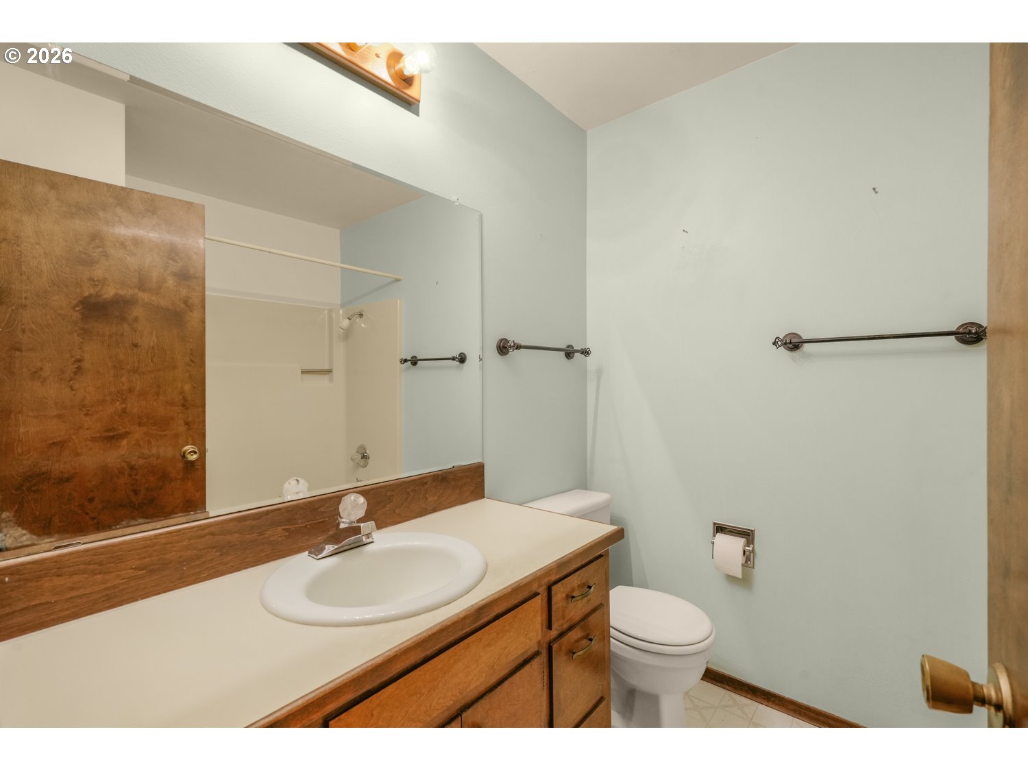14155 Southwest 27th Street Beaverton, OR 97008 - Photo 17 of 27 a bathroom with a sink a toilet and shower
