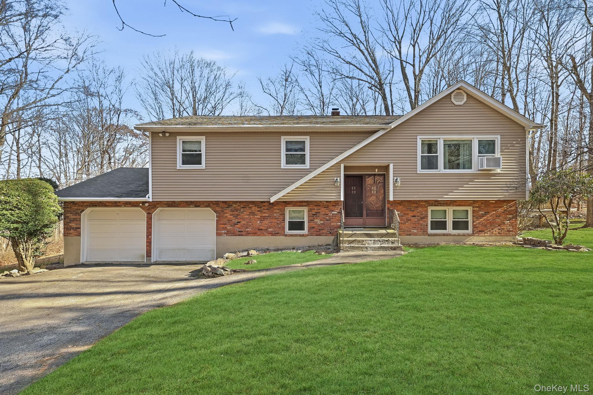 42 Bayberry Hill Road Mahopac, NY 10541 - Photo 1 of 49 Bi-level home with driveway, a front yard, and brick siding