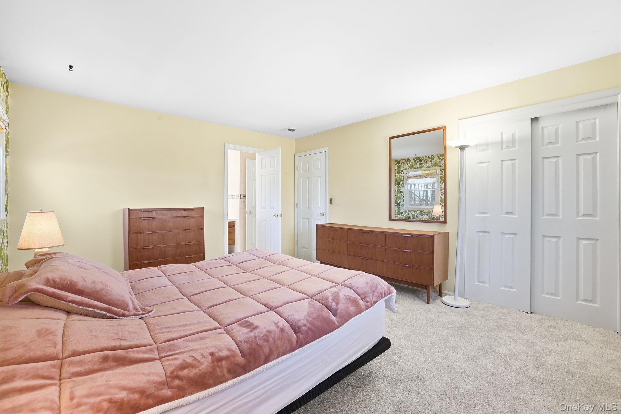 42 Bayberry Hill Road Mahopac, NY 10541 - Photo 16 of 49 Carpeted bedroom featuring two closets