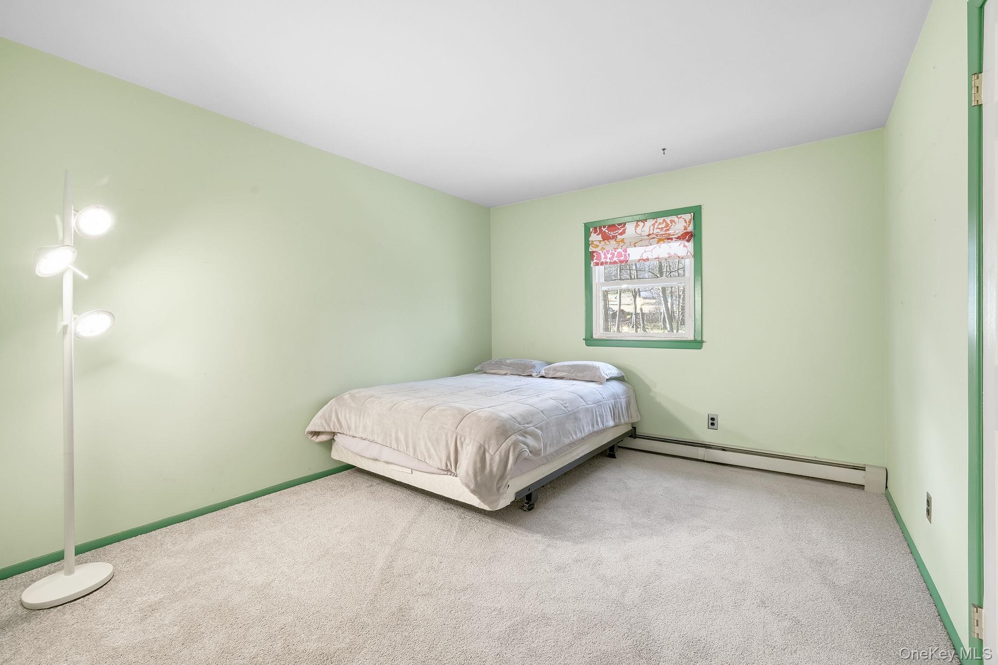 42 Bayberry Hill Road Mahopac, NY 10541 - Photo 19 of 49 Bedroom with a baseboard heating unit and carpet floors