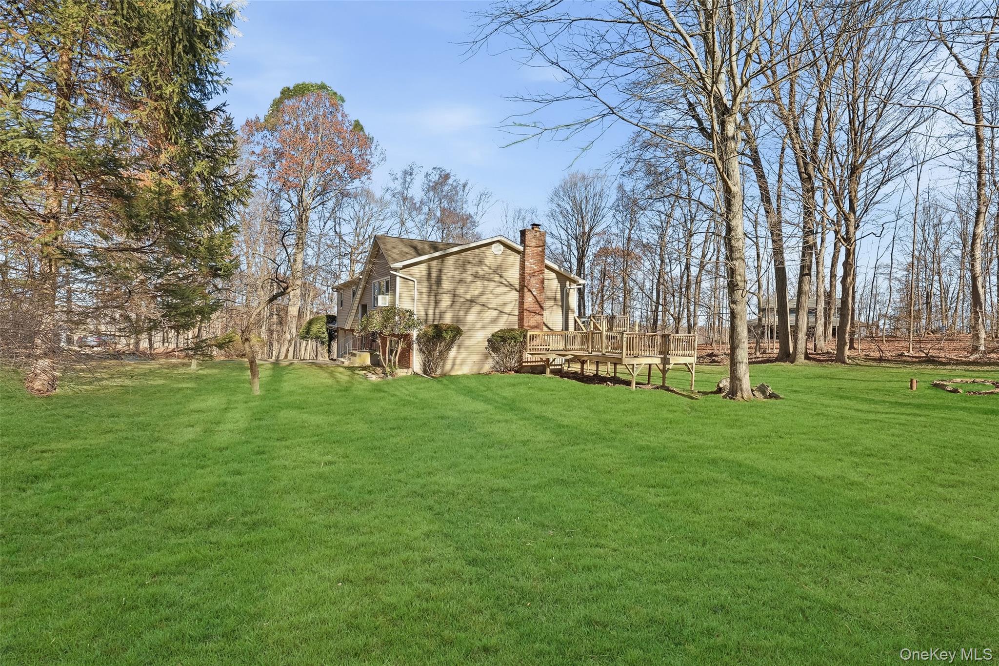42 Bayberry Hill Road Mahopac, NY 10541 - Photo 46 of 49 View of grassy yard featuring a wooden deck