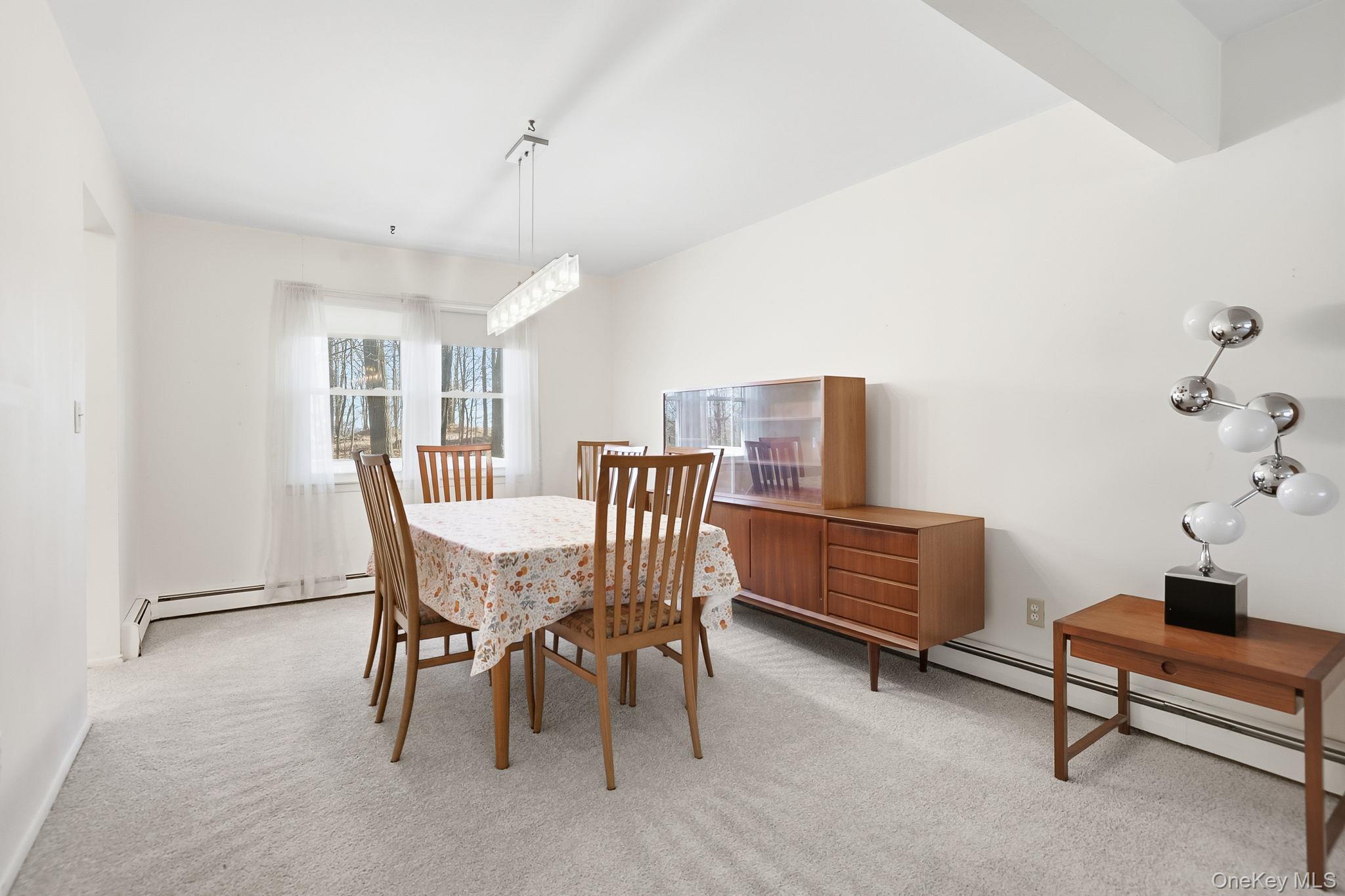 42 Bayberry Hill Road Mahopac, NY 10541 - Photo 8 of 49 Dining room featuring a baseboard heating unit and light colored carpet